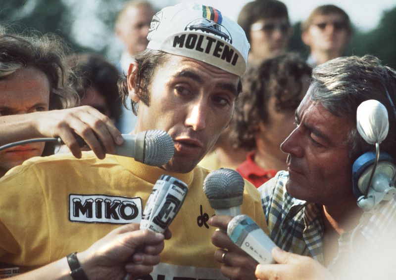 Eddy Merckx in hot demand from reporters ahead of the final stage of the 1974 Tour