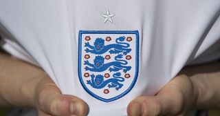 England badge on the home shirt ahead of the UEFA 2020 European Football Championship on May 27, 2021 in Manchester, United Kingdom. 