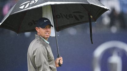 Rory McIlroy under an umbrella