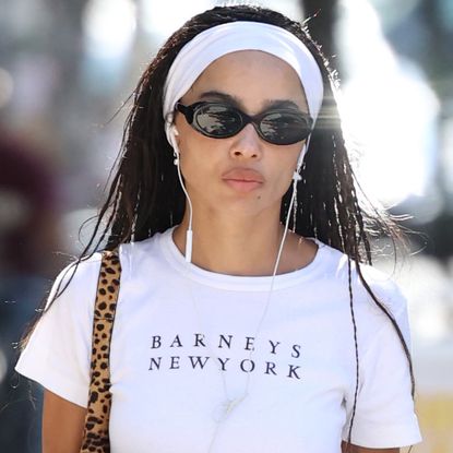 Zoë Kravitz styled micro shorts and the peep-toe pumps trend with a white Barneys T-shirt