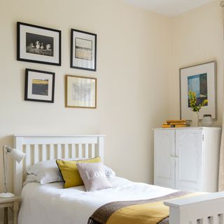 Bedroom picture wall in cream bedroom