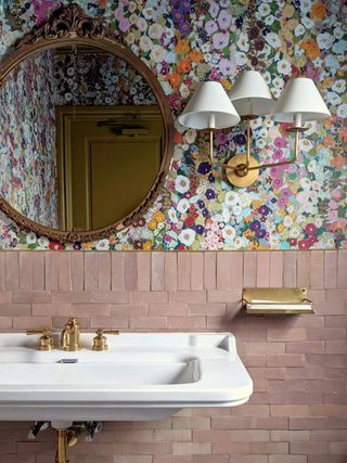 pink bathroom with colorful floral wallpaper by Crystal Sinclair Designs