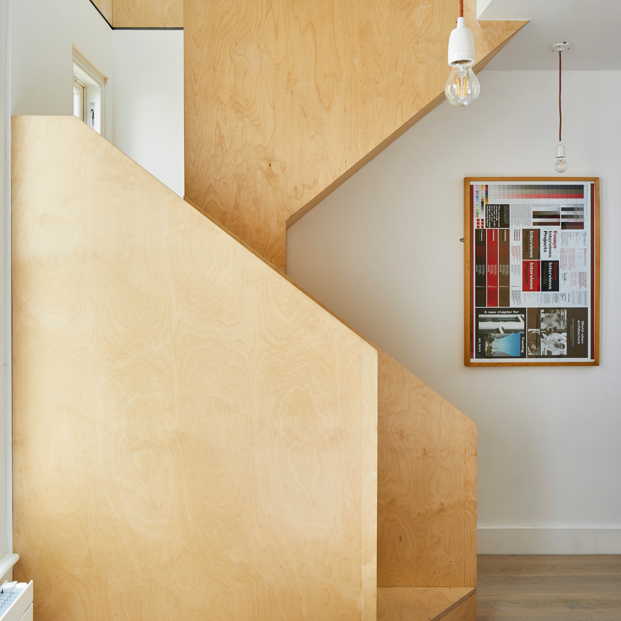 A sculptural modern staircase in a loft house