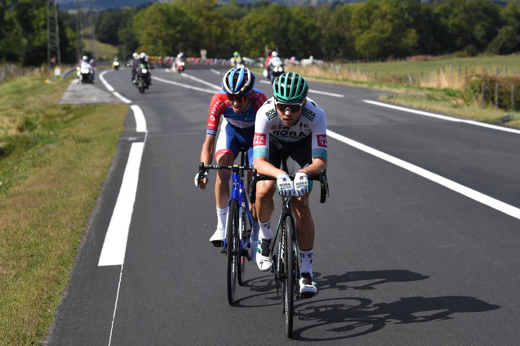 CANTAL FRANCE SEPTEMBER 11 Romain Sicard of France and Team Total Direct Energie Maximilian Schachmann of Germany and Team Bora Hansgrohe during the 107th Tour de France 2020 Stage 13 a 1915km stage from ChtelGuyon to Pas de PeyrolLe Puy Mary Cantal 1589m TDF2020 LeTour on September 11 2020 in Cantal France Photo by Tim de WaeleGetty Images