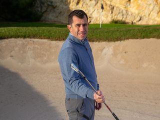 Golf Monthly Top 50 Coach Dan Grieve with a 5-iron bunker drill in the greenside bunker