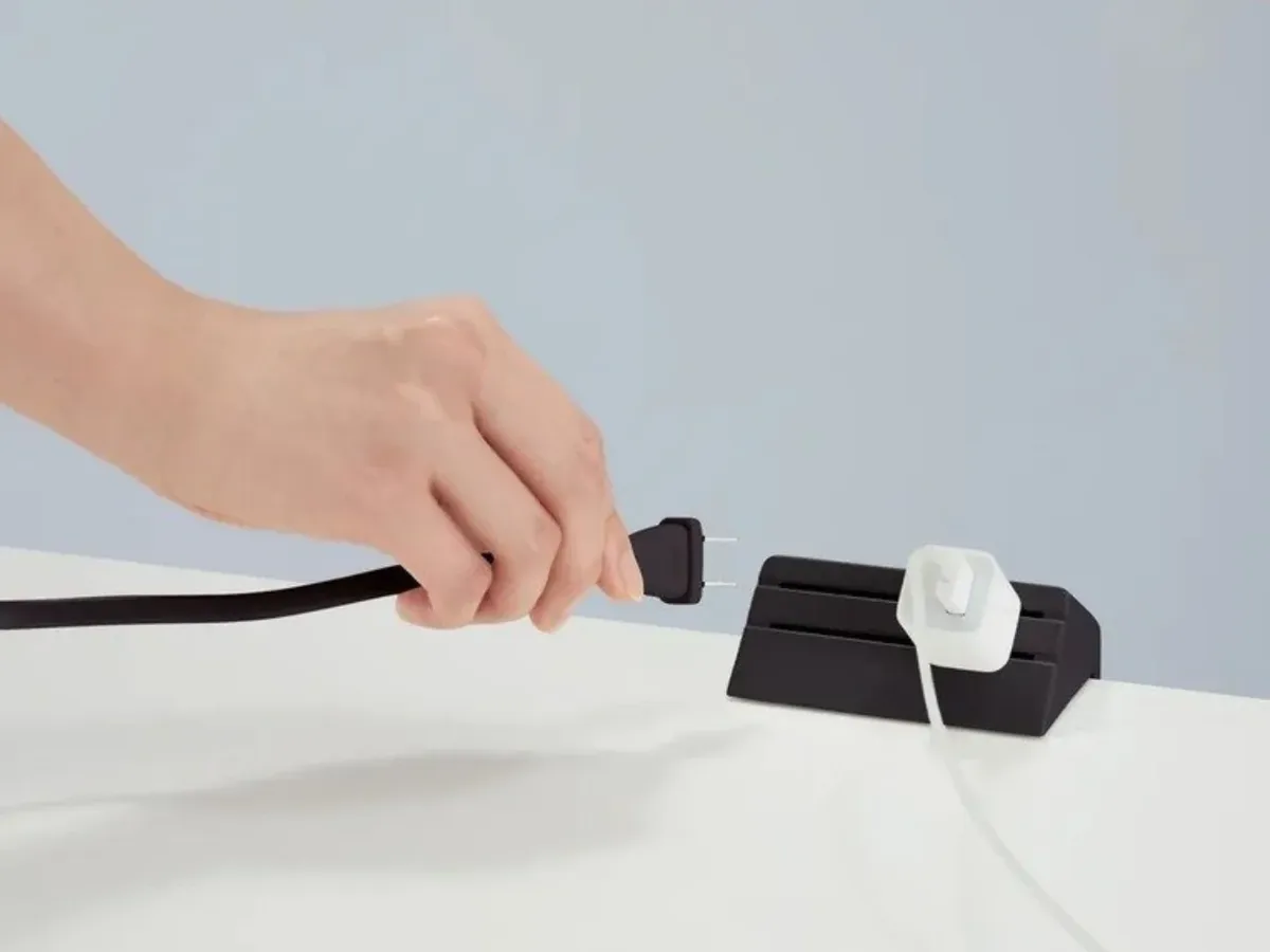 This sleek Japanese power strip finally fixes your office desk's ugliest pain point