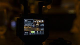 The Zoom Q8n-4K handy recorder on a table in a pub