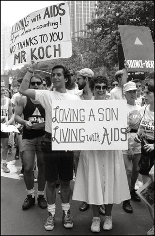Mark Fotopolous of ACT UP and his mom, the 20th anniversary of the Stonewall riots, participating in a renegade march up 6th avenue to Central Park, 1989. 