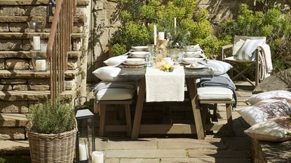 outdoor dining space on a sunny courtyard patio