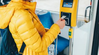 woman putting in bus