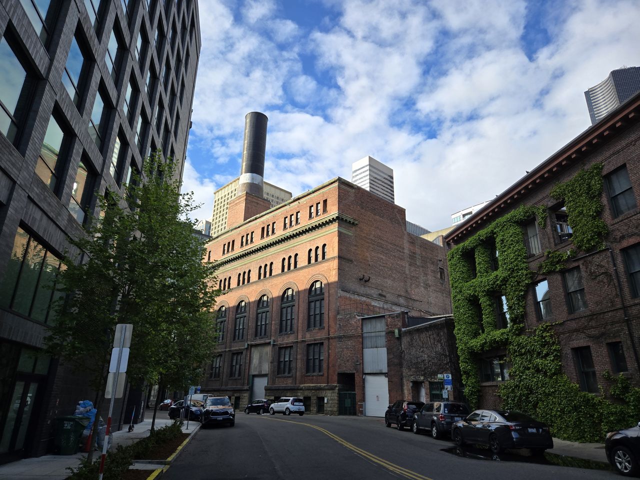 A brick building with a smokestack on top