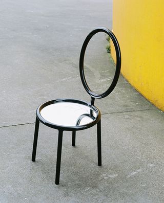 Dior Medallion chair black metal resin and finished with a mirrored sea