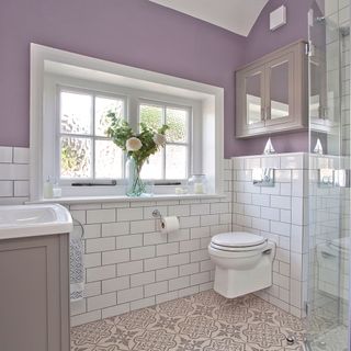 bathroom with metro tiles and flower vase
