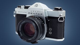 The Pentax Spotmatic camera on a blue background