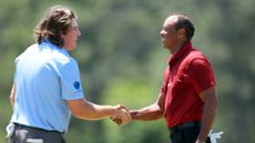 Neal Shipley and Tiger Woods shake hands after their fourth round of the Masters
