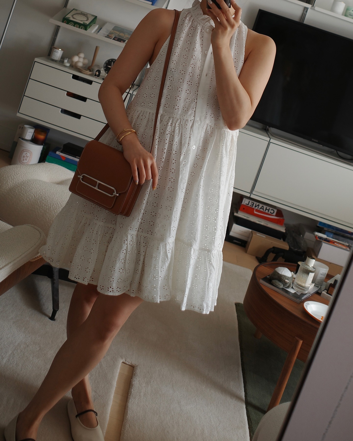 Influencer wearing a flared mini dress and flat shoes