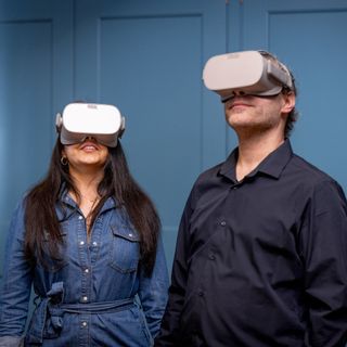 Man and woman wearing VR headset
