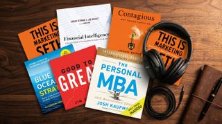 Audiobooks on a wood desk