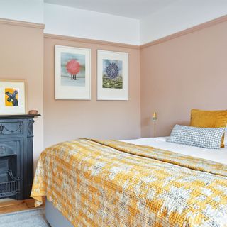 peach bedroom with yellow bedspread