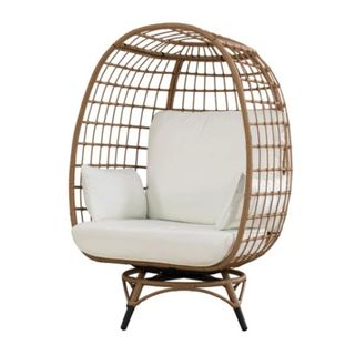 A white egg chair with a brown rattan casing