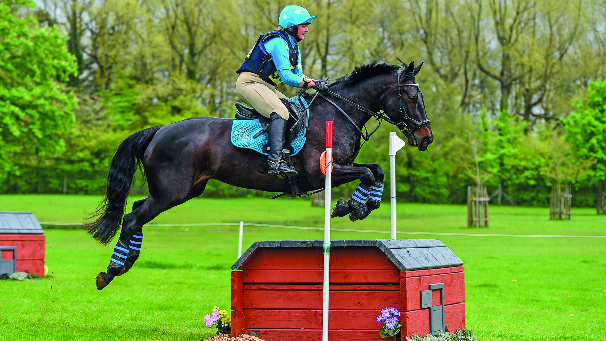 Katie Brickman and Greenkeld&amp;rsquo;s Moondance jumping a cross-country fence in the BE90 eventing level grassroots championship at Badminton.