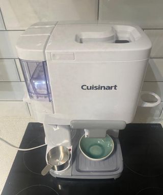 Assembled Cuisinart Soft Serve Ice Cream Maker with small teal ceramic bowl underneath