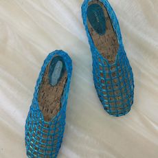 a pair of blue Mara jelly flats from The Row