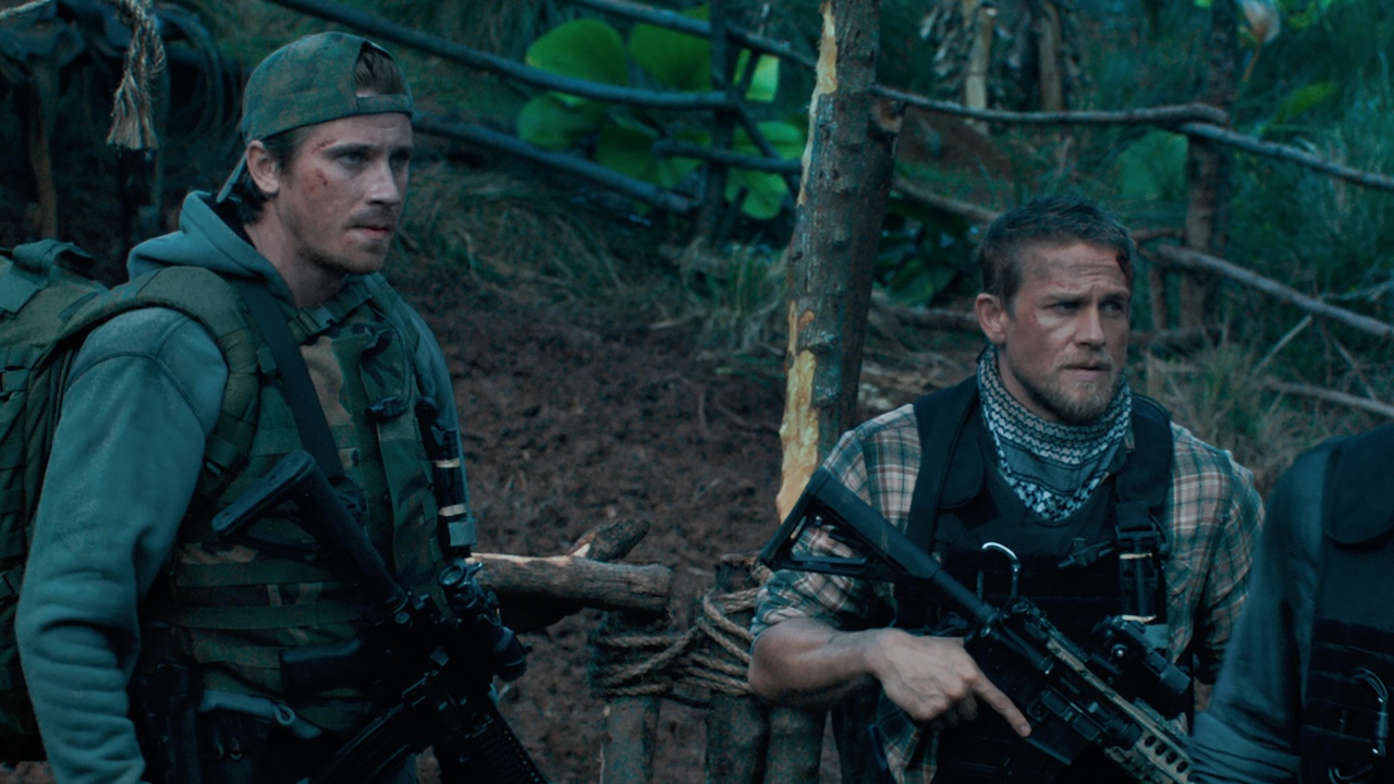 Ben and Ironhead Miller holding guns in Triple Frontier