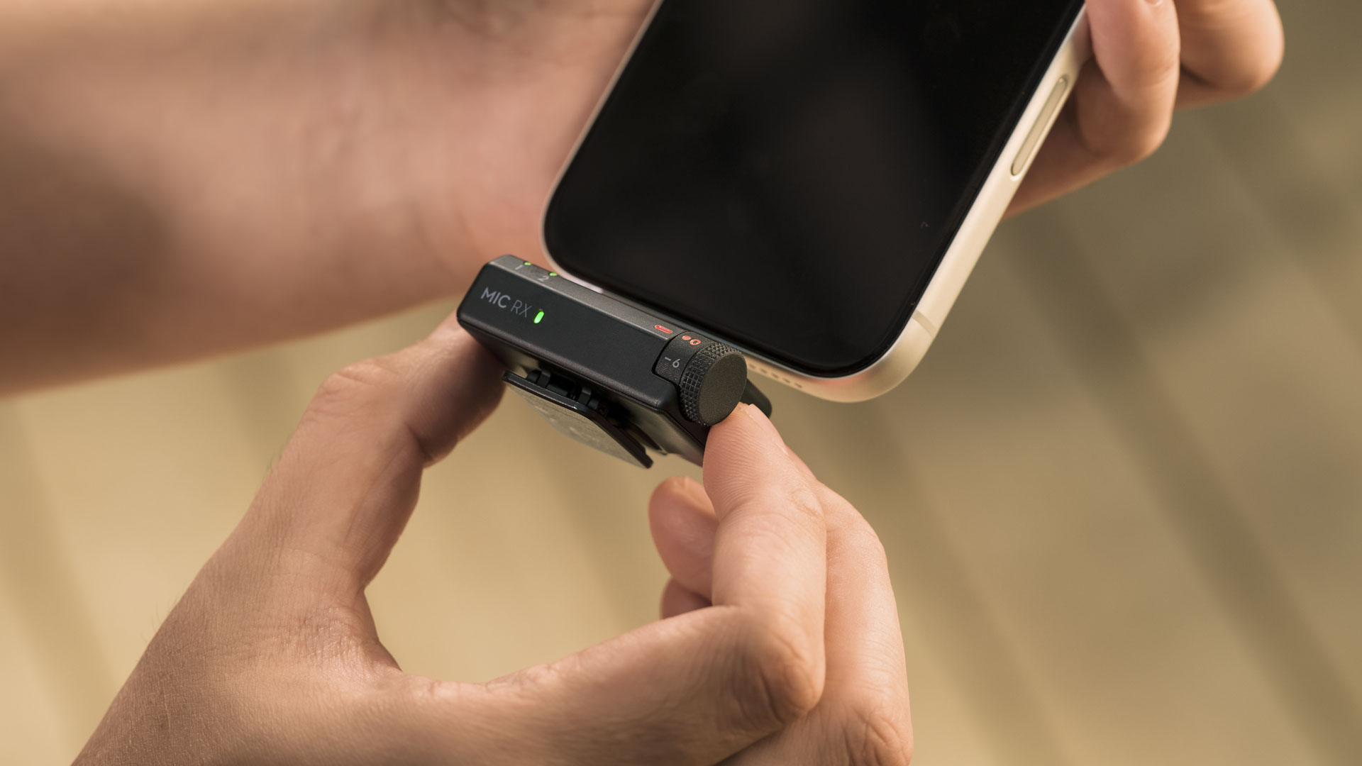 DJI Mic Mini 2 standard receiver being attached to a phone