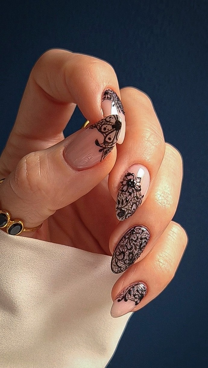 Photo of a black lace nail look