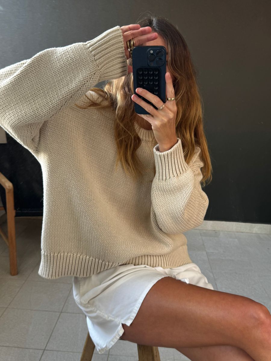 Angie wears a cable knit jumper from Navy Grey.