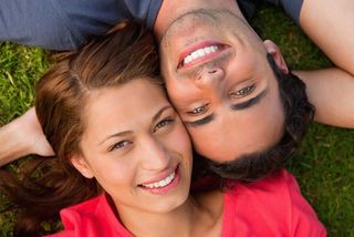 man and woman smiling