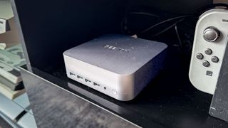 Geekom Mini PC with 4K TV on stand in living room