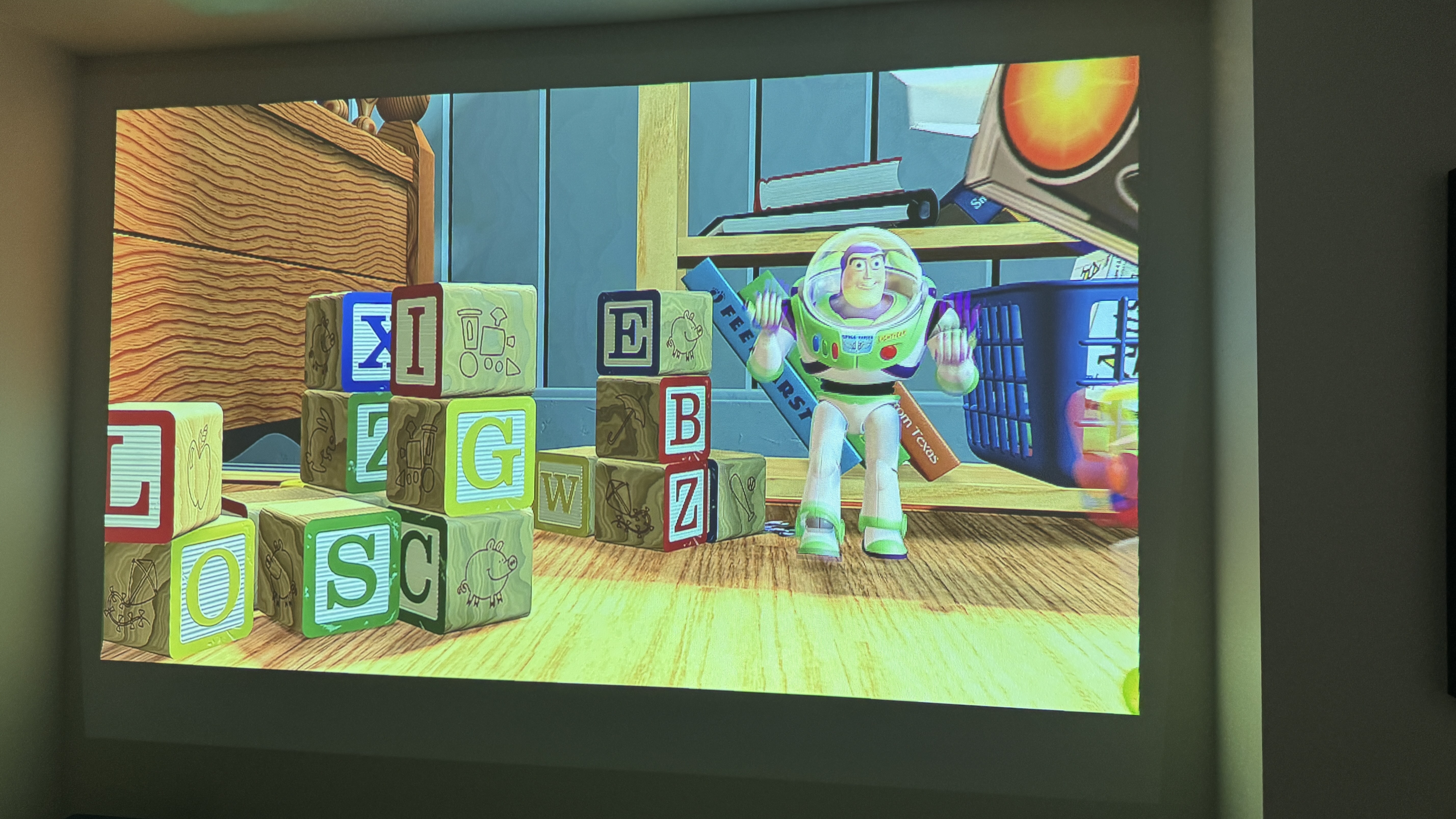 A scene from Toy Story projected onto a wall by the XGIMI MoGo 3 Pro projector