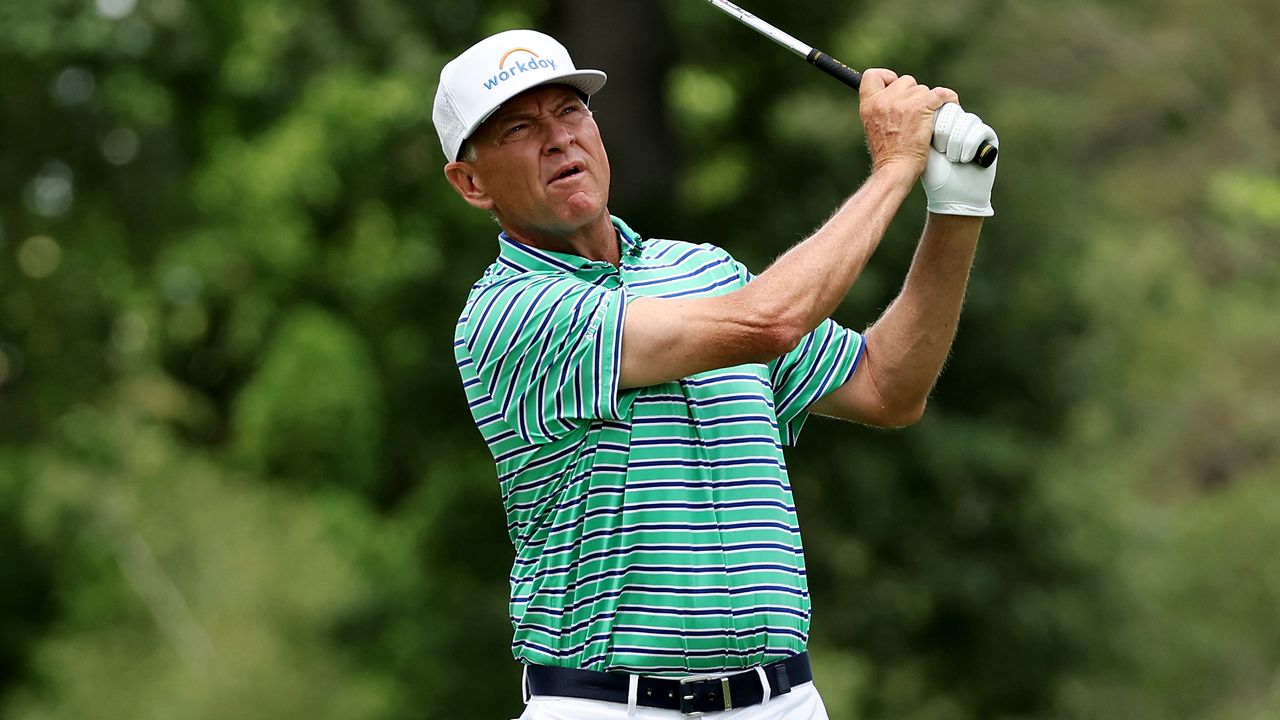 Davis Love III hits a golf shot