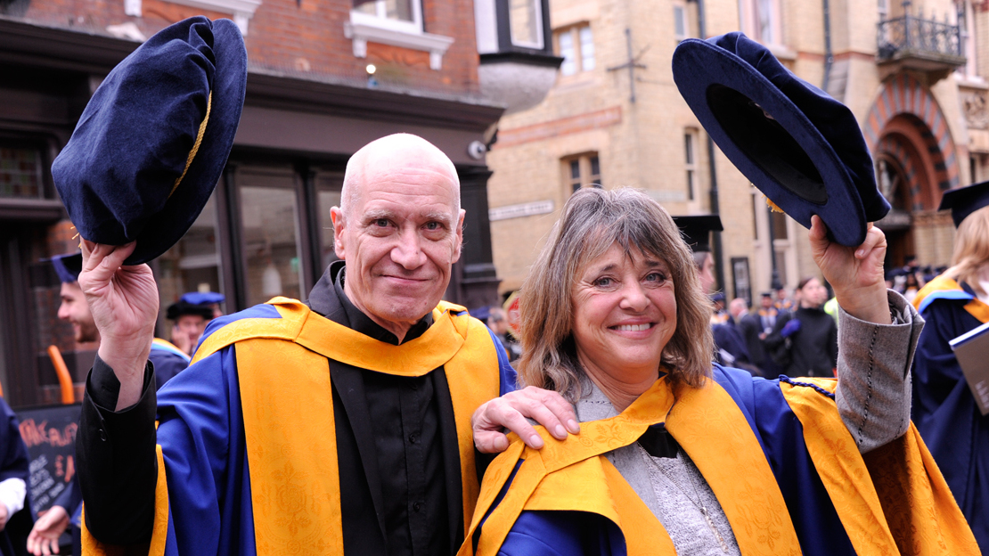 A picture of Wilko Johnson and Suzi Quatro with their honorary doctorates at Anglia Ruskin University