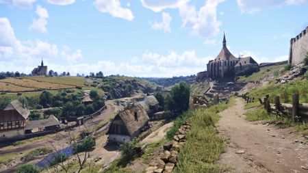 The countryside with churches and small houses in Kingdom Come: Deliverance 2