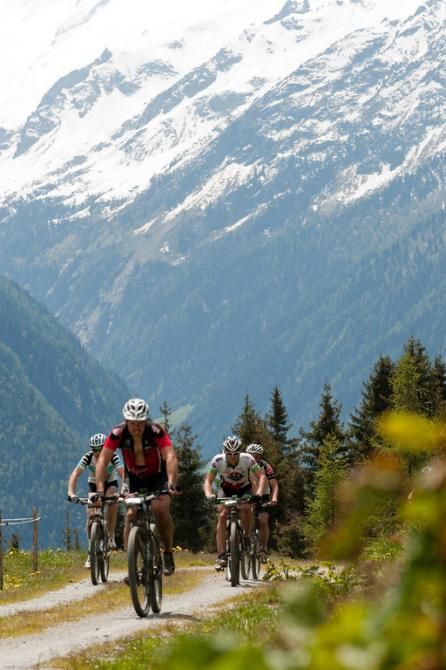 A small group of riders climbs during the Bike Four Peaks
