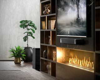 Media wall showing a soundbar and TV and fireplace