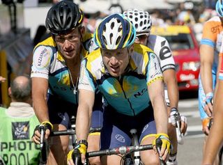 Levi Leipheimer leads his Astana teammate Lance Armstrong across the finish line.