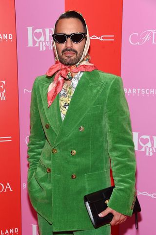 An image of Marc Jacobs in a green suit who said one of the best fashion quotes