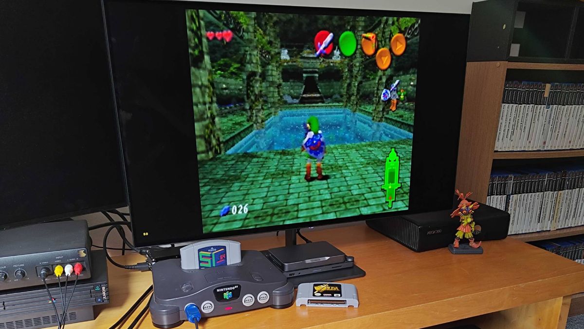 Nintendo 64 setup featuring original console, SummerCart64, and Dough Spectrum Black 32 monitor with Zelda Ultimate Trial ROM hack gameplay on screen.