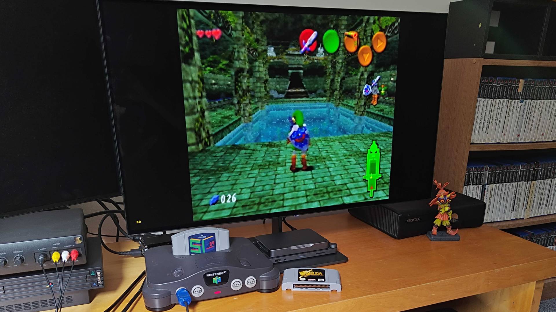 Nintendo 64 setup featuring original console, SummerCart64, and Dough Spectrum Black 32 monitor with Zelda Ultimate Trial ROM hack gameplay on screen.