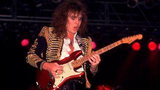 Yngwie Malmsteen live onstage in 1985, shredding a red Stratocaster