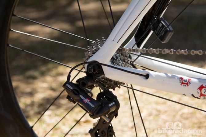The rear derailleur wire is routed through the chainstay
