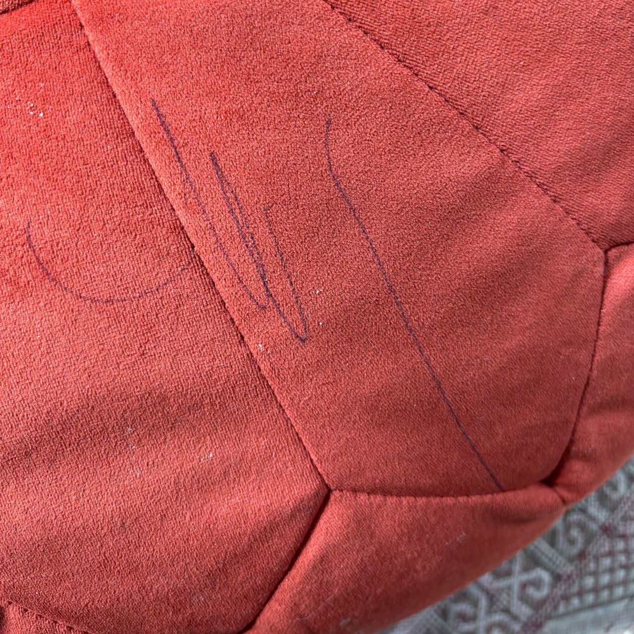 biro stain on red pouffe