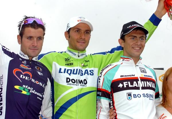 Giario Ermeti and Daniele Colli flank Ivan Basso on the podium