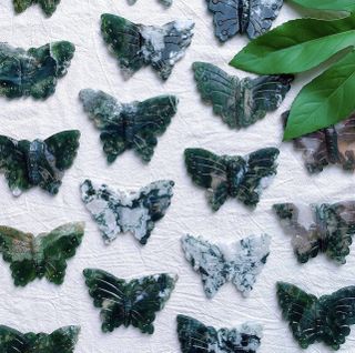 Moss agate butterfly stones clustered together