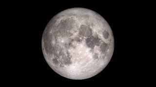 The full moon against a black background.