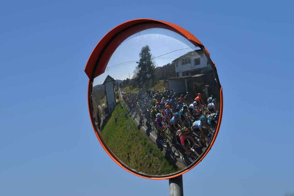 The peloton reflected in a mirror